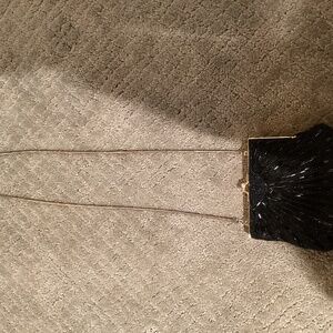Partners by Mervin black beaded clutch with dark gold shoulder strap